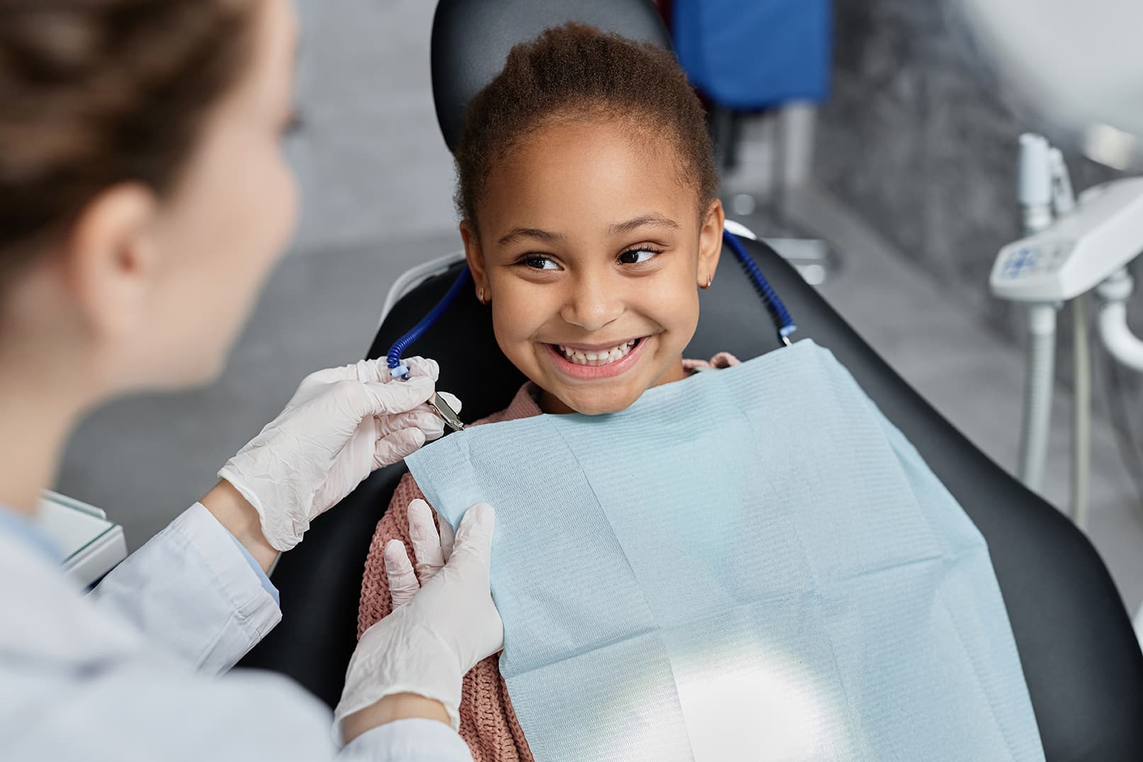 toddler dental patient smiling during pediatric dental treatment at kelly family dentistry