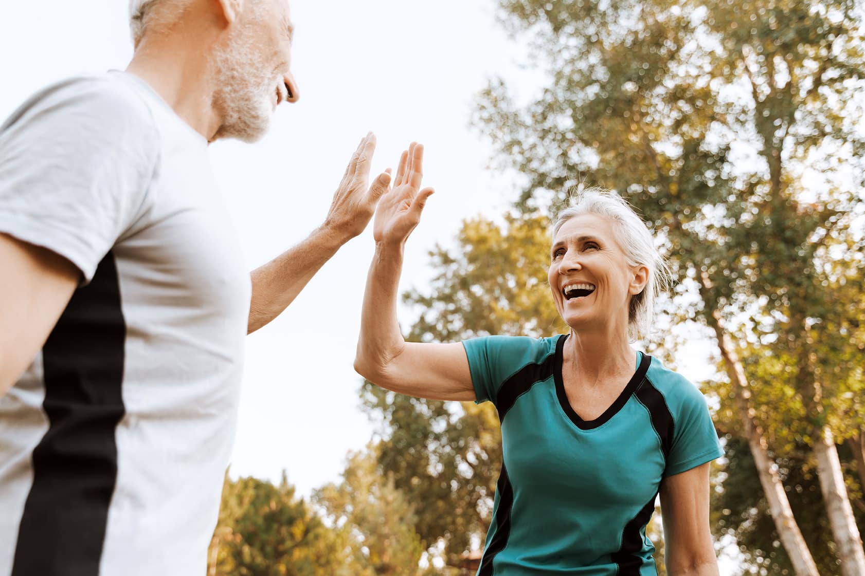 adults in franklin tn high fiving while playing sports