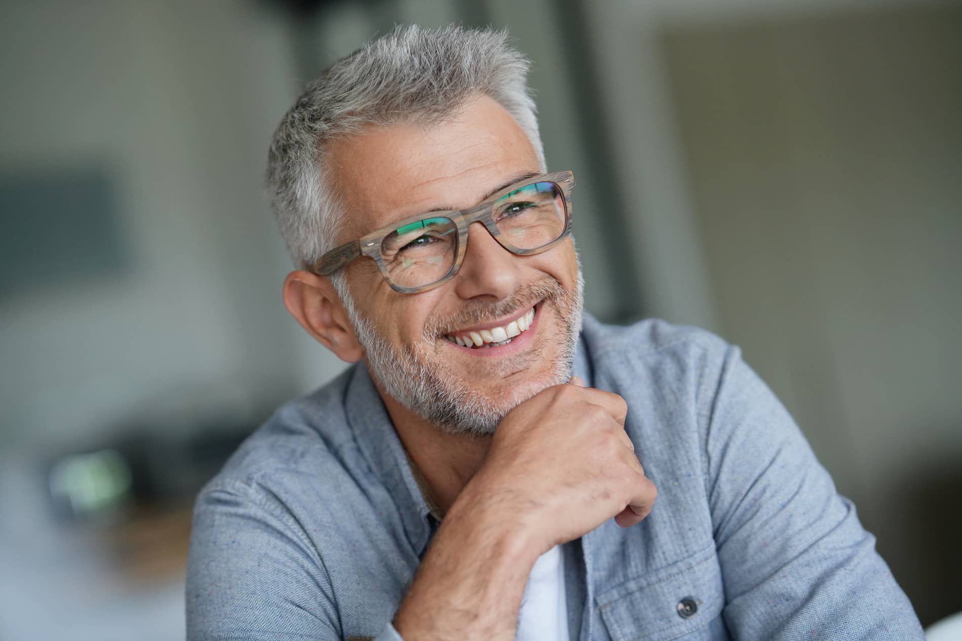 Man smiling on his way to a dental implant restoration appointment in Franklin