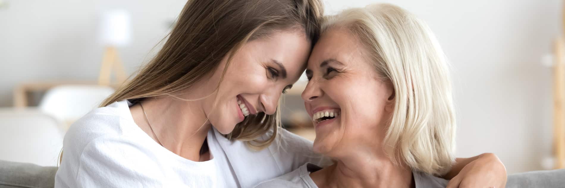 Women smiling together after getting dental implant surgery in Franklin TN